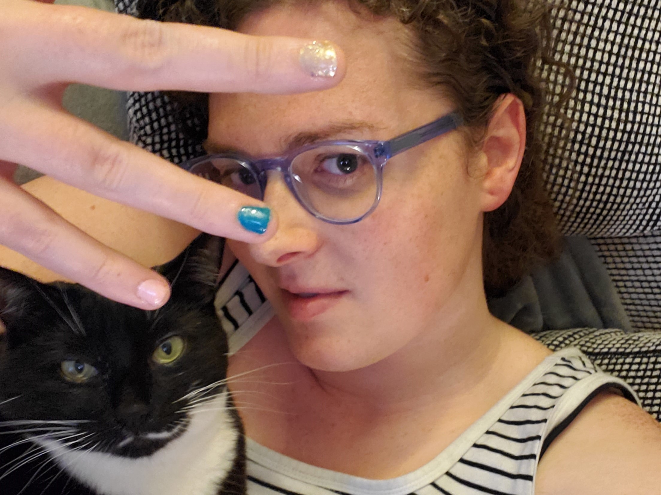 Emily with painted nails & Maya the cat